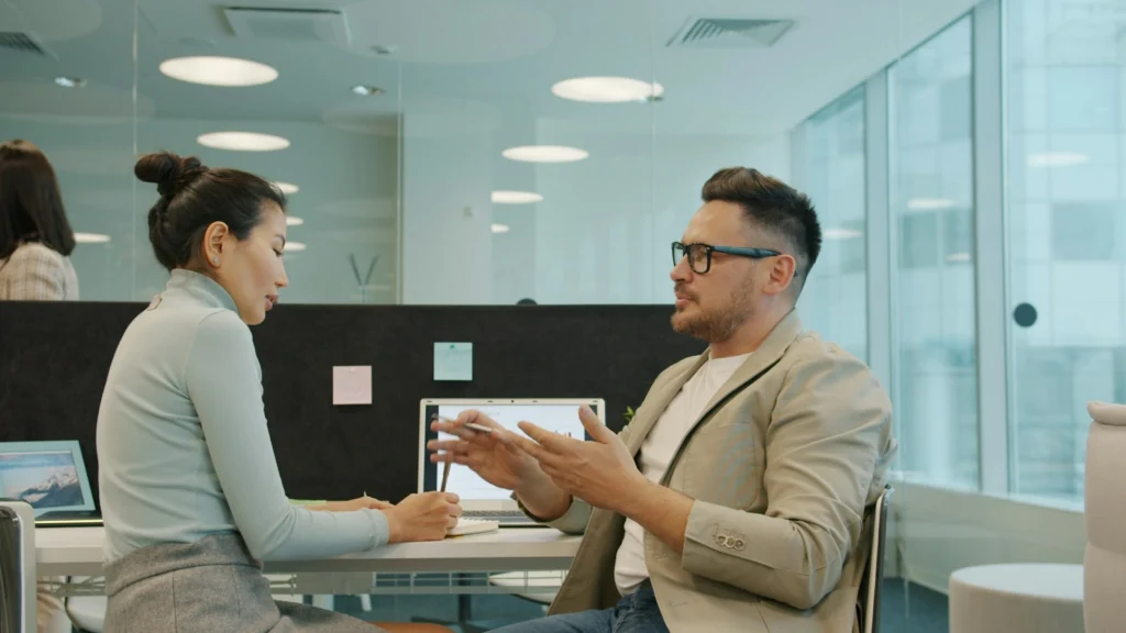 A coach and client in a one-to-one conversation